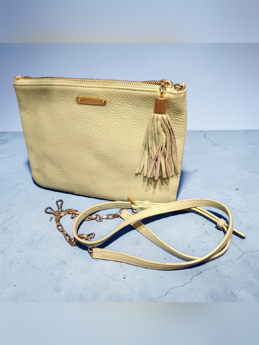 Gili Mint Green Pebbled Leather crossbody bag with tassel.
